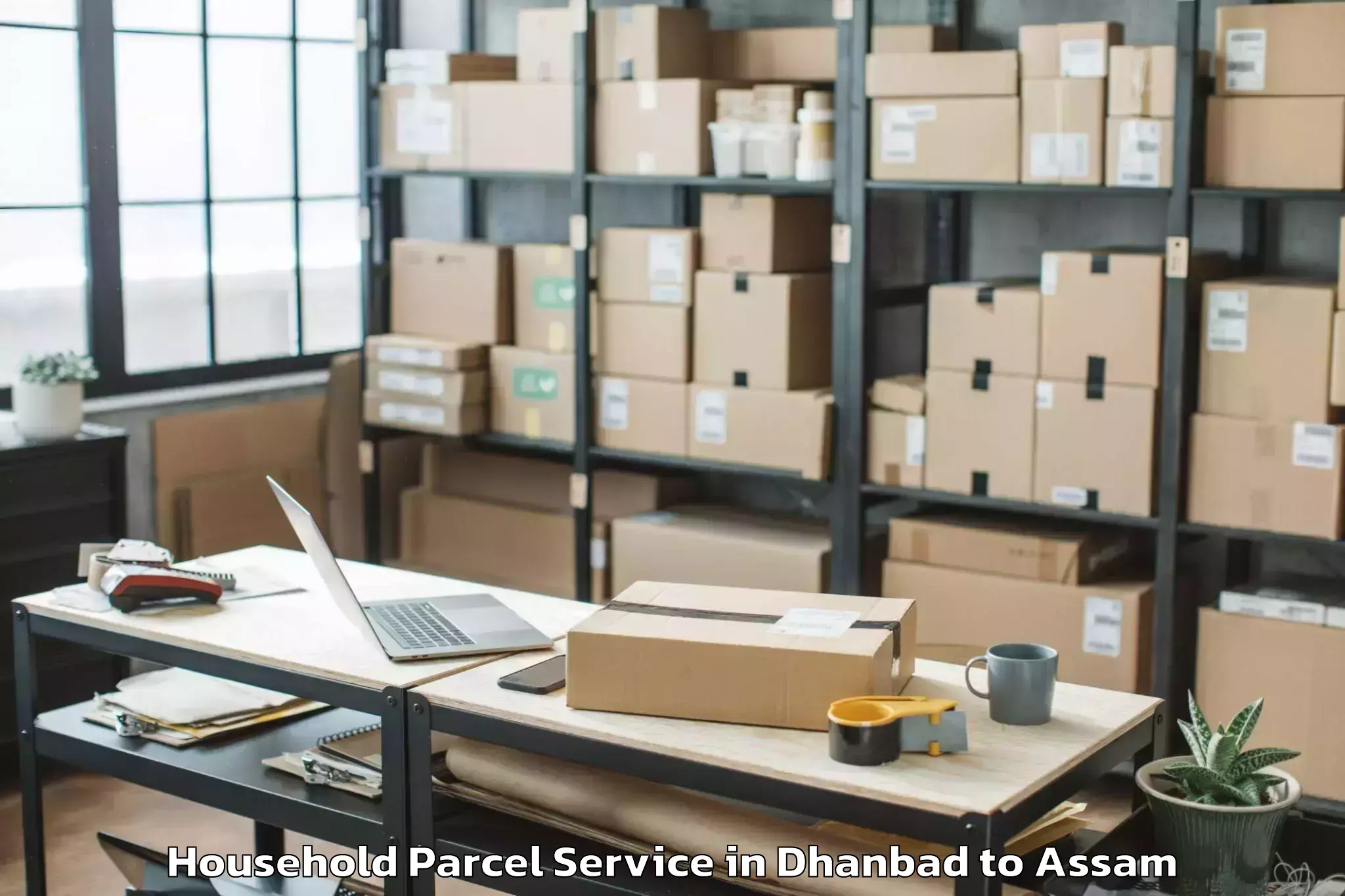 Trusted Dhanbad to Jamugurihat Household Parcel